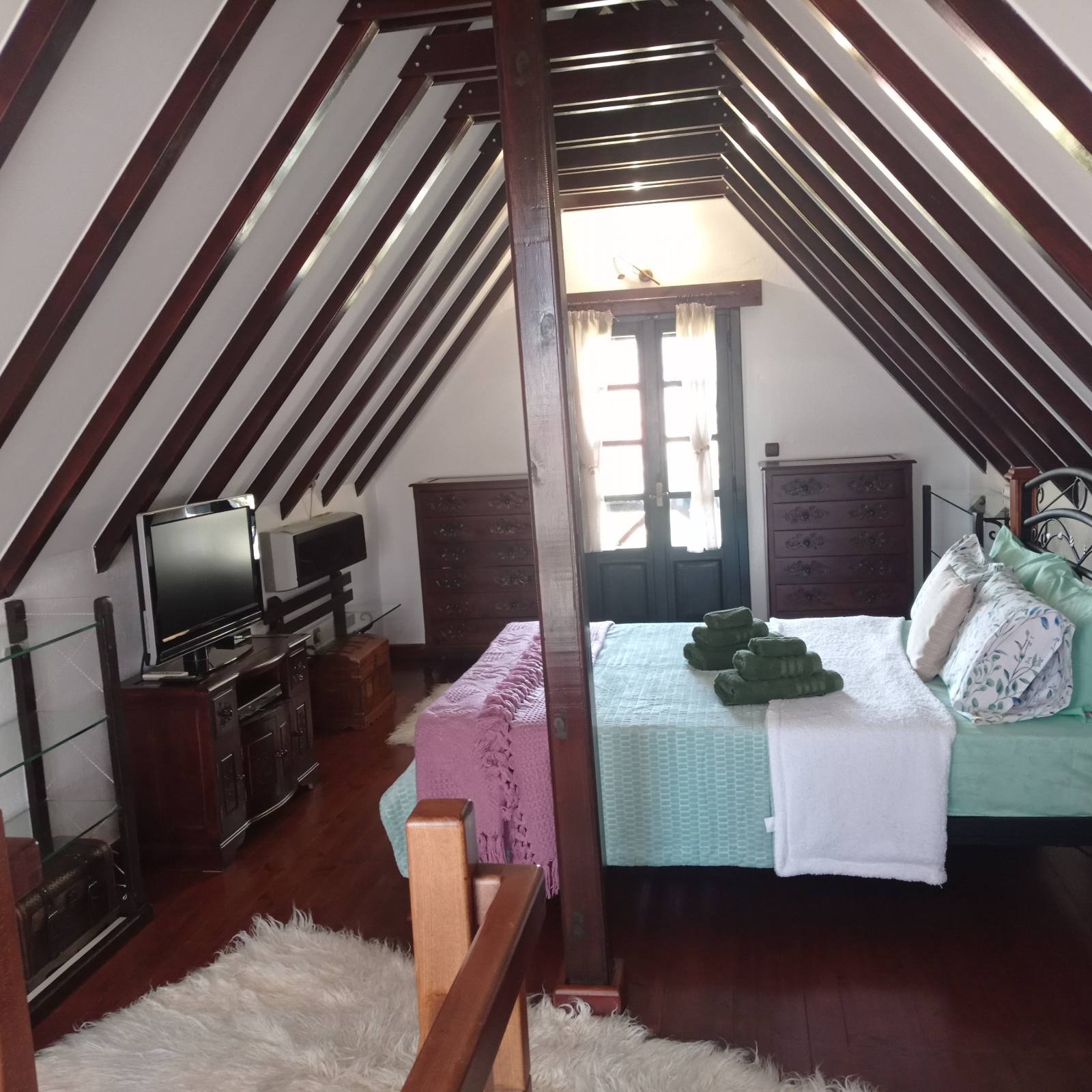 Loft bedroom with wooden beams